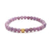 Pink Rubin krystal armbånd med forgyldt perle